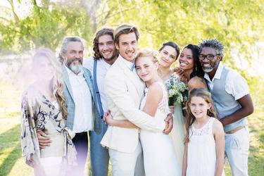 The couple with the bridesmaids, groomsmen and flower girl