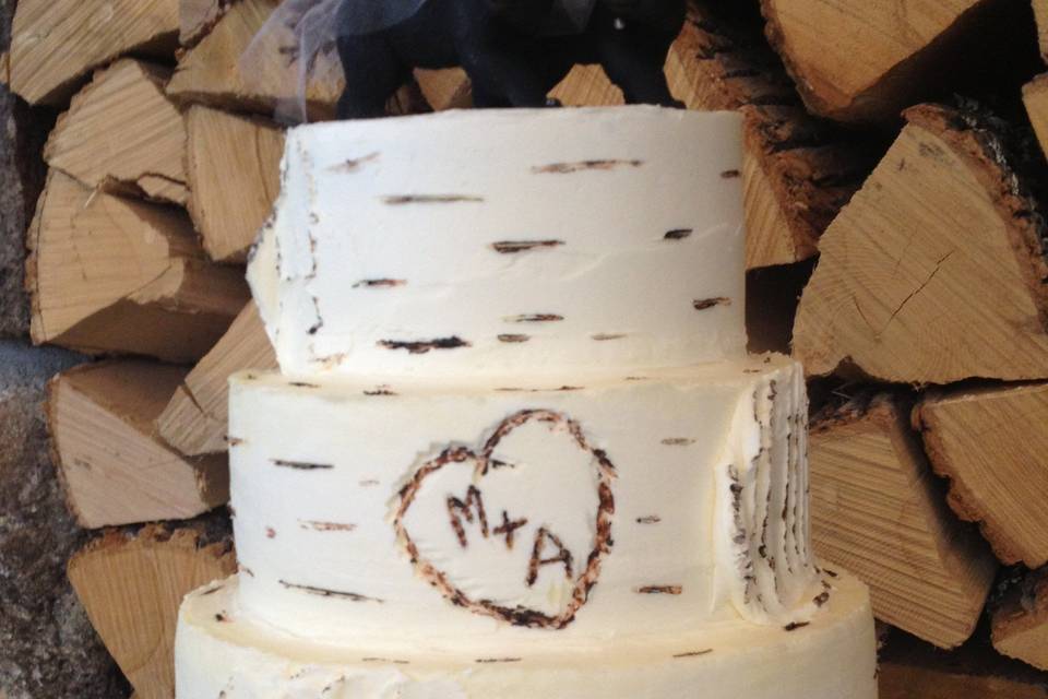 Birch inspired cake with carved initials.  Chocolate sour cream cake with espresso buttercream filling and vanilla buttercream frosting.  At Christmas Farm Inn, Jackson Village, NH.