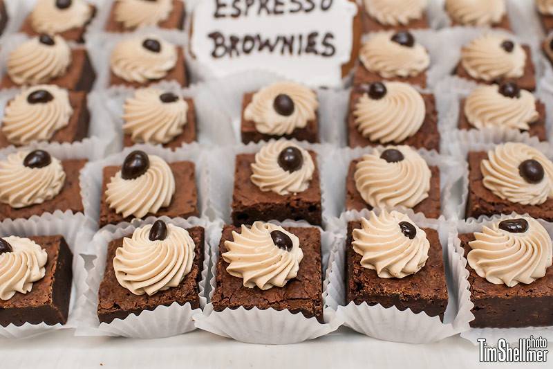 Bite-sized, dark chocolate brownies topped with espresso buttercream rosettes and dark chocolate covered espresso beans.