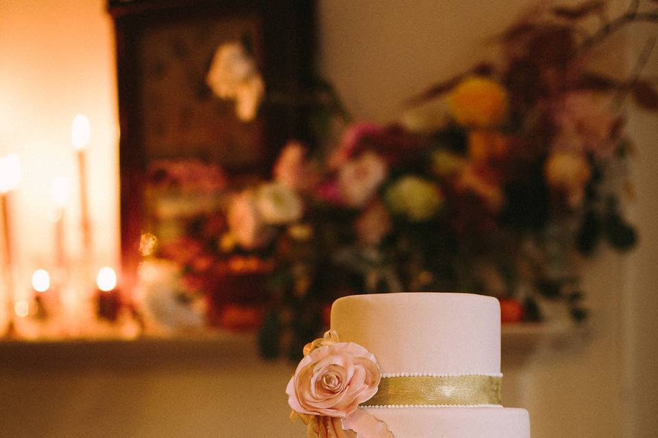 Ruffles and roses with gold bands and teardrop piping.  Photo by Courtney Elizabeth Media.