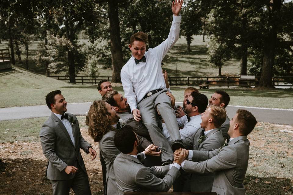 A groom being tossed around!