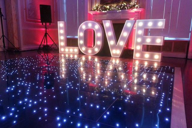 Lighting of letter decor and dance floor