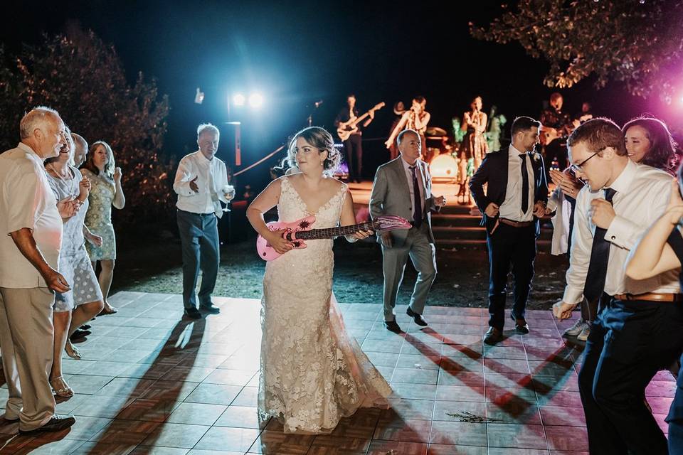 Bride crushing blow up guitar