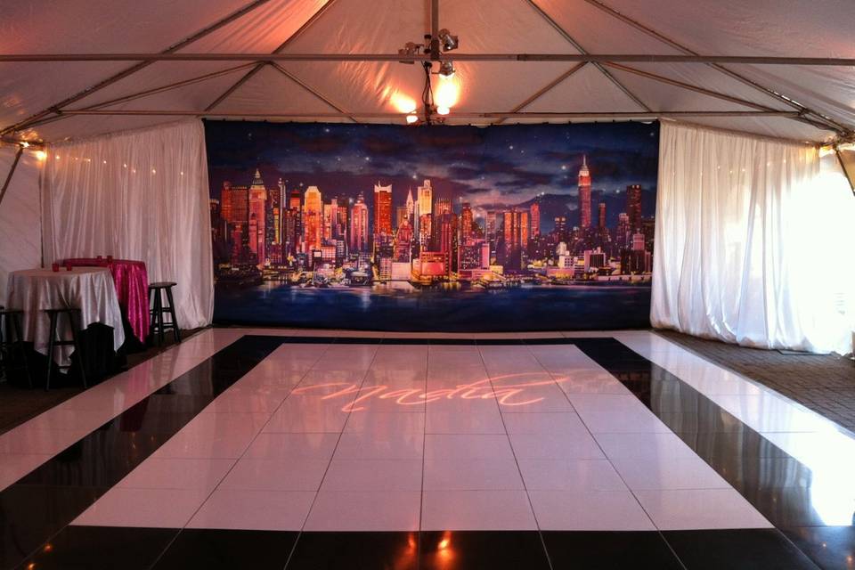 White and black dance floor with draping.