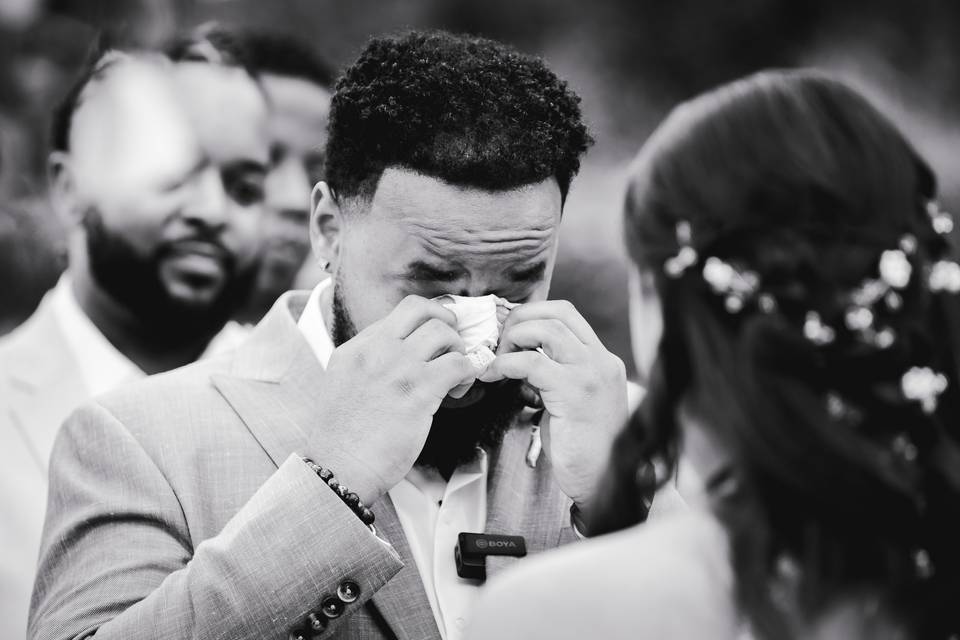 Groom wiping tears