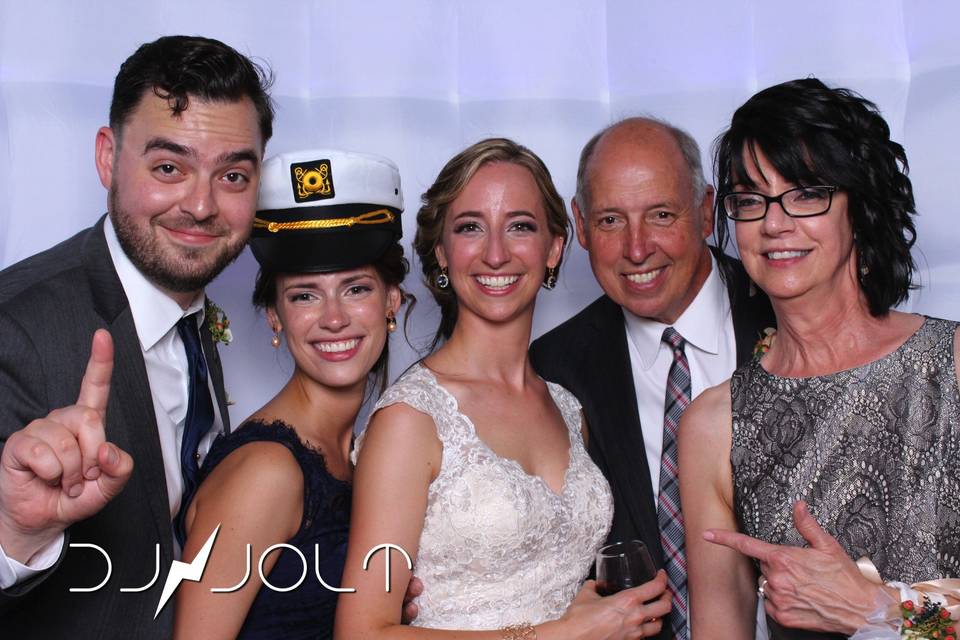 Newlyweds and their guests in the booth