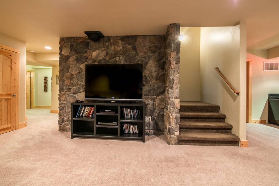 TV / Stairs in Basement