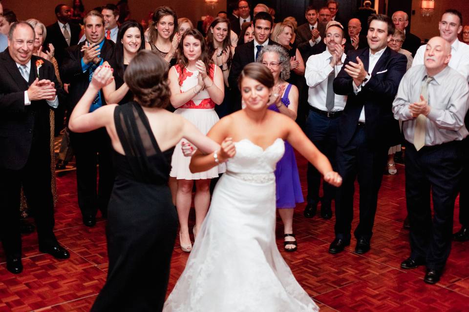 The couple with their guests dancing