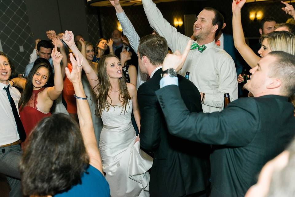 The couple with their guests dancing