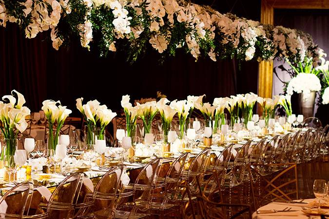 Elegant Head Table gorgeously designed with gold accents and lovely white flora