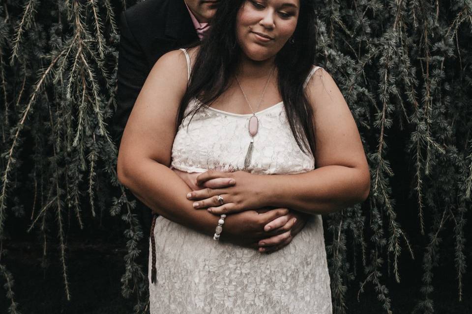 Embracing beside a tree