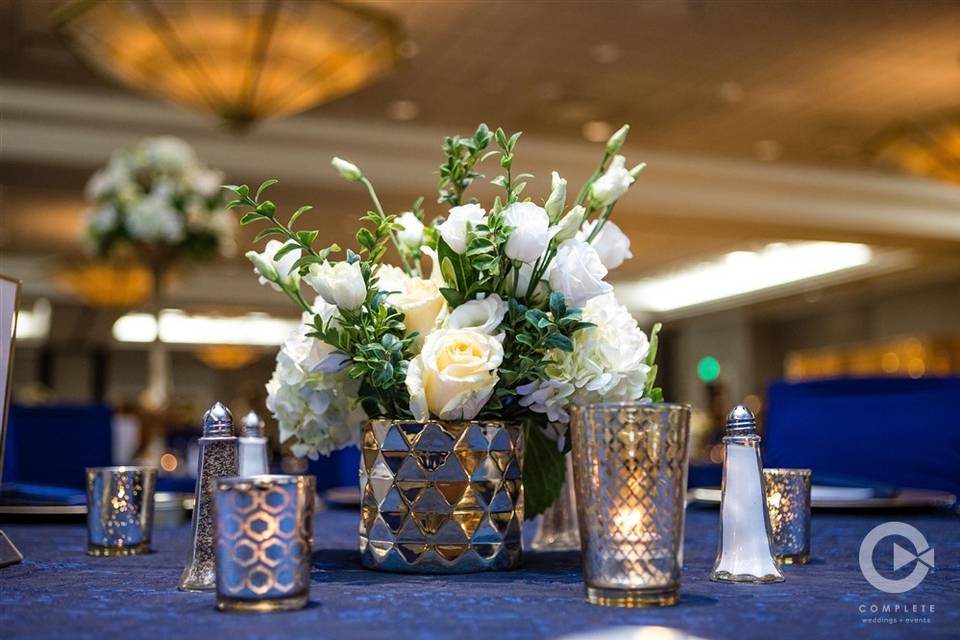 Cream roses and blue table cloth