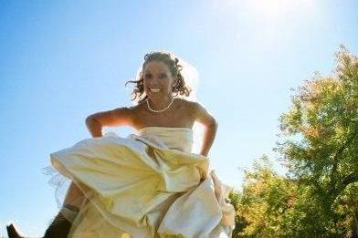 Having a little fun with our wedding gown and cowgirl boots