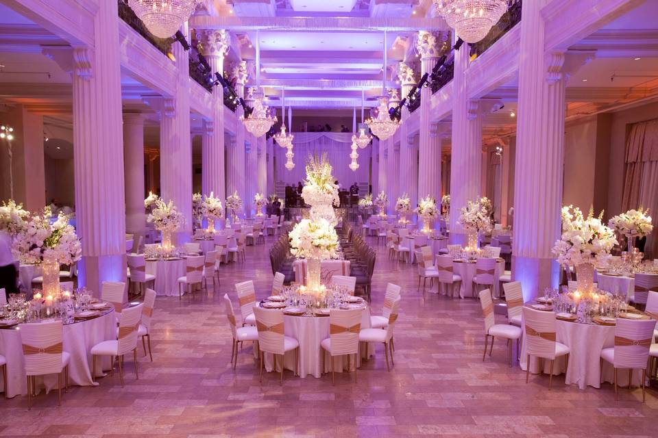 Lavish reception with pink uplighting