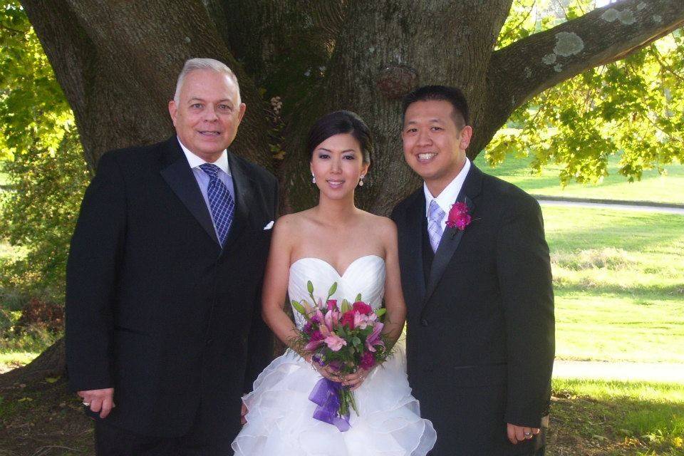 Newlyweds with the officiant