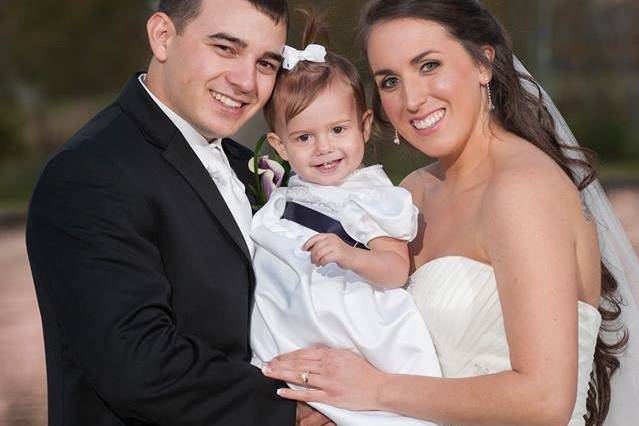 Groom and bride with baby