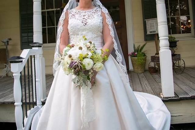 Bride holding gown