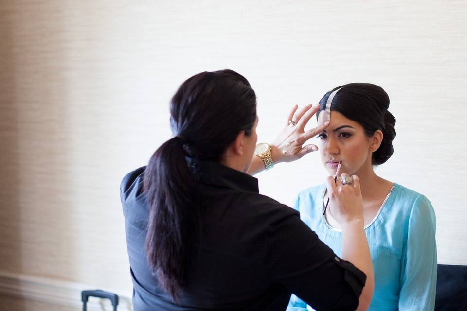 Me, gluing Bride, Sana's tiki to her forhead.Image by Kimberly Phtography (Kimberly Romano)