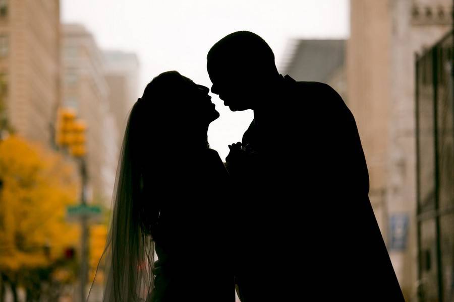 Bride and groom in backlight