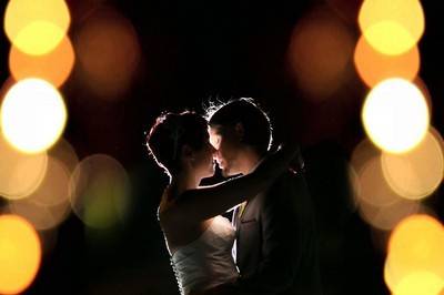 Bride and groom in backlight