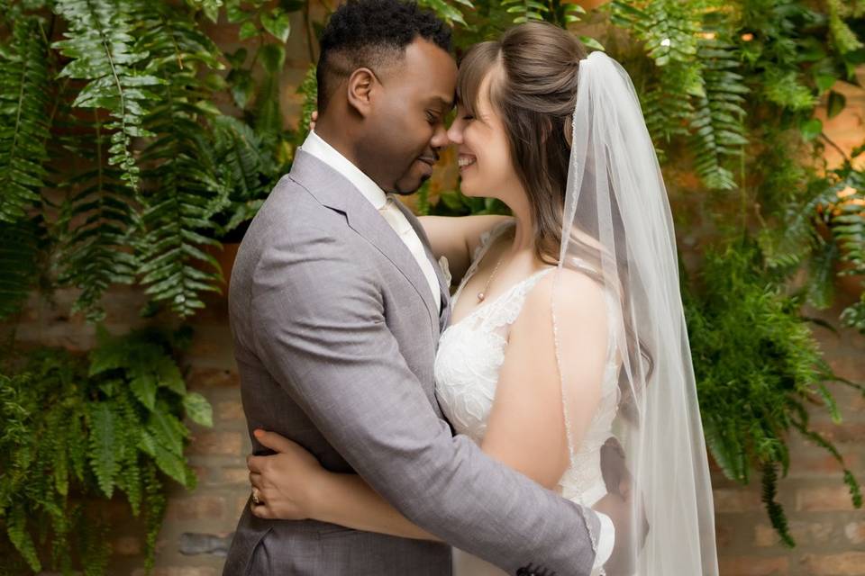 Couple in Front of Green Wall