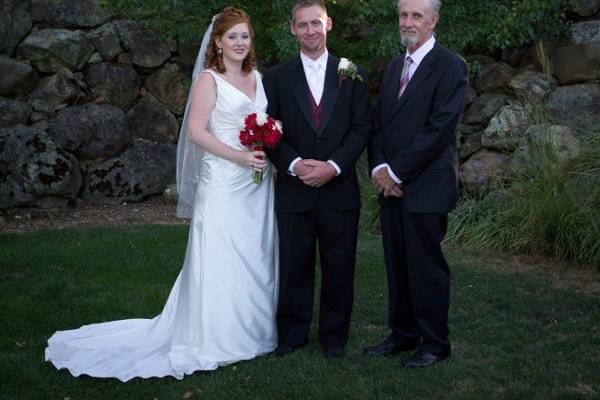 The newlyweds and the officiant