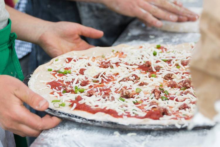 Preparing the pizza