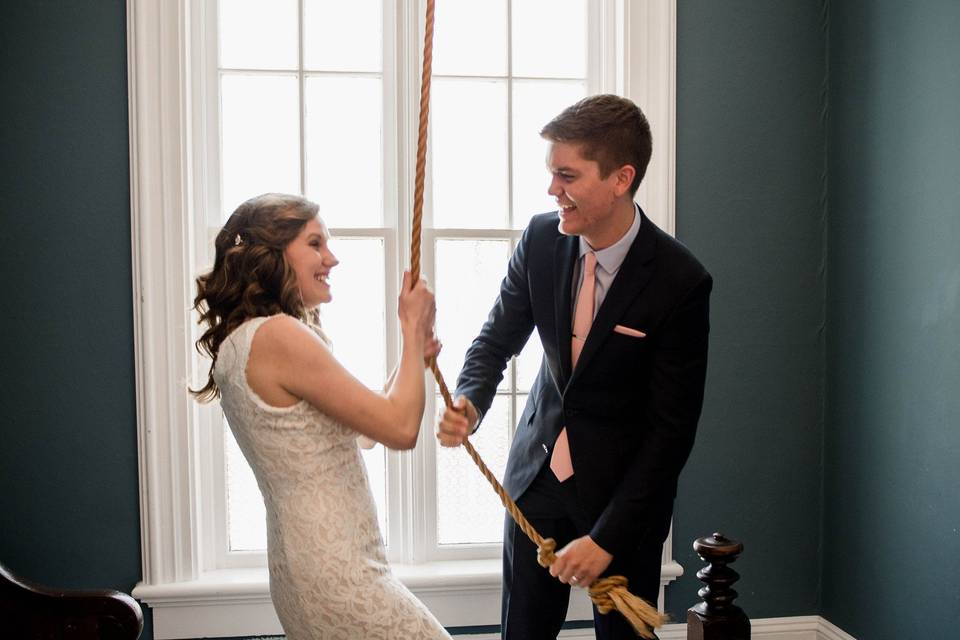 Couple ringing the bell after ceremony