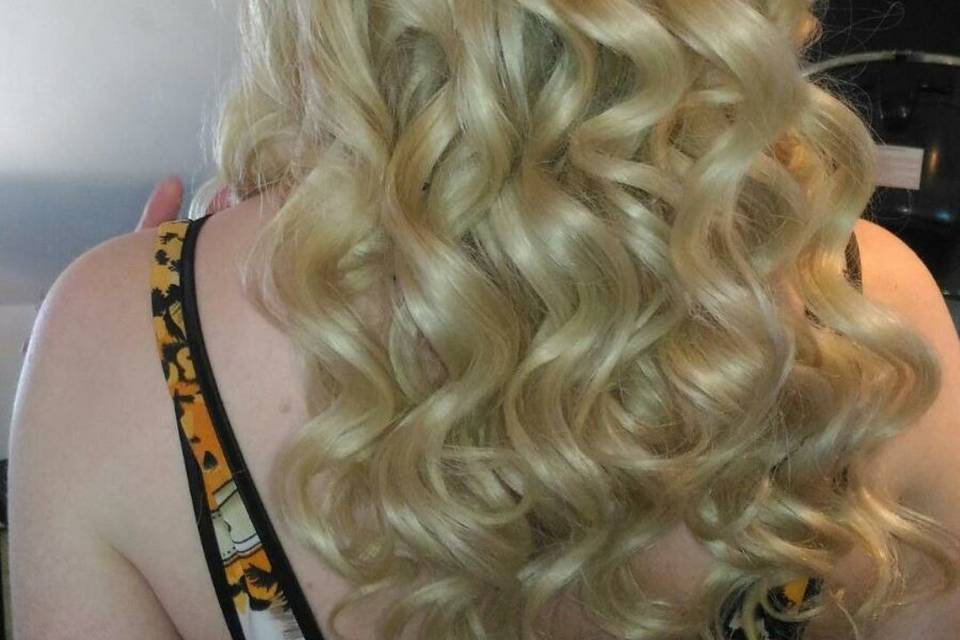 Half up w/ loose barrel curls