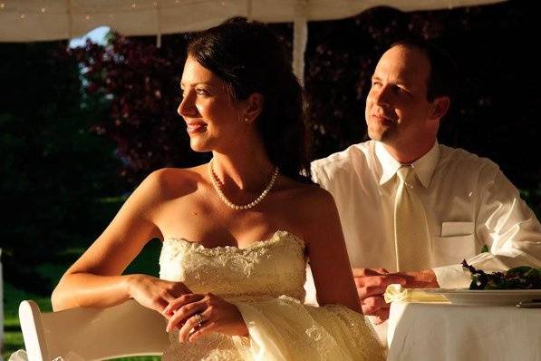 Laura and Curtis listening to their toast