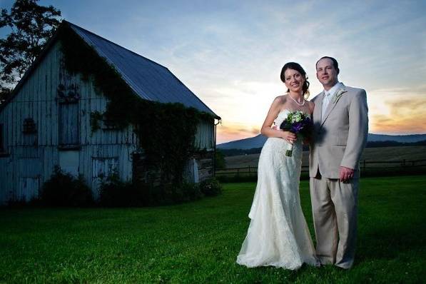 Laura and Curtis posing by the barn at the Comus Inn