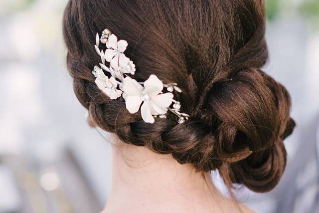 Low side bun with flower hair ornament