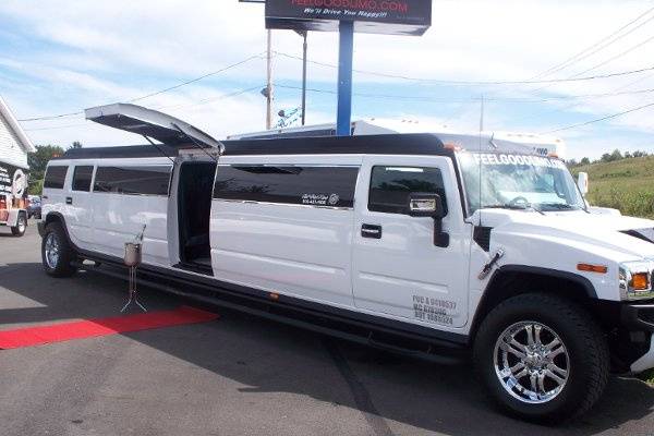 White 20 passenger Hummer with 5th door