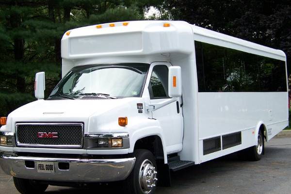 White 27 passenger GMC Limo Bus