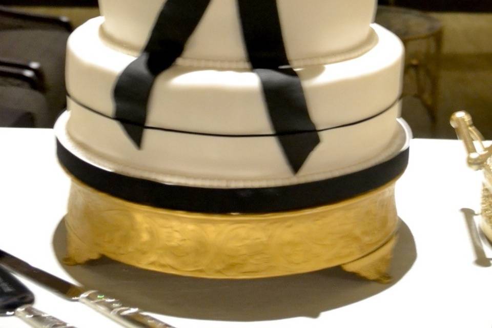 White cake with black bow
