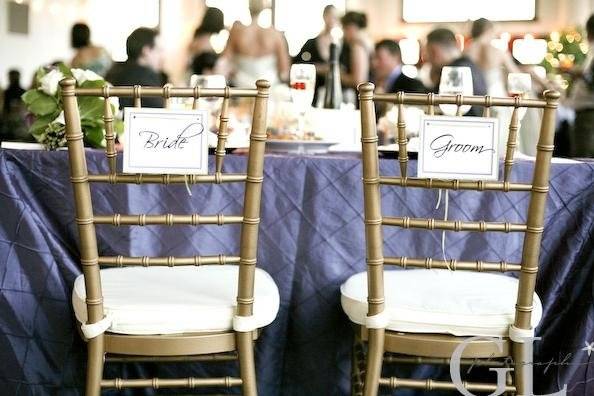 Cute signs denote seats for the newlyweds at Danielle & Ryan's wedding