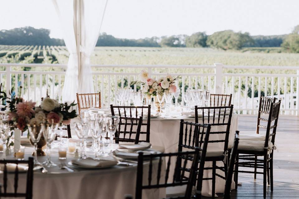 Tables and chairs set in vineyard wedding