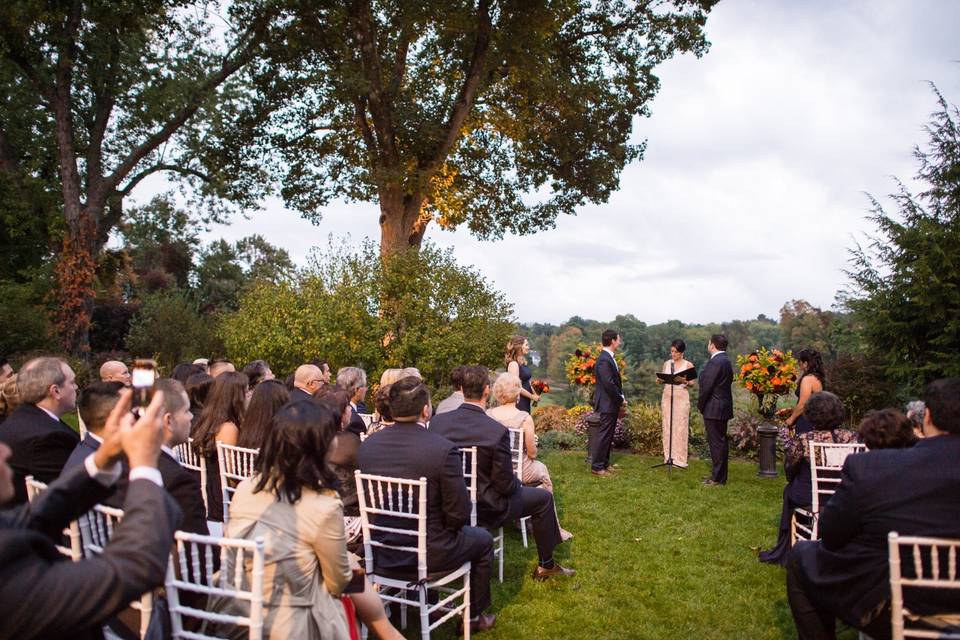 Ceremony set up by large tree