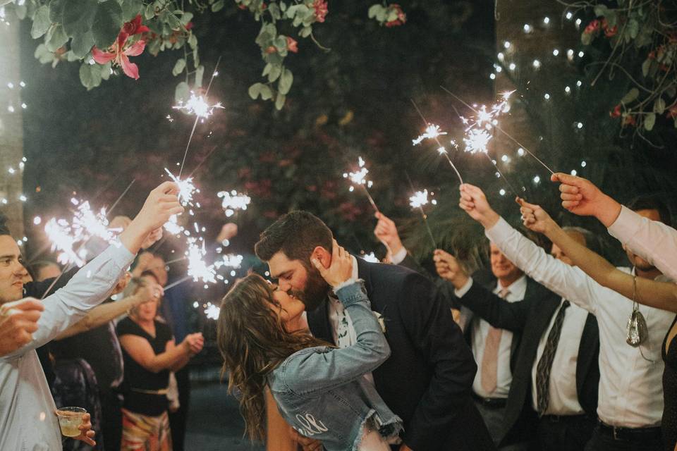 A kiss surrounded by sparklers