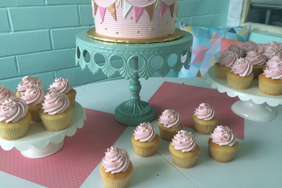 Pink cake and cupcakes