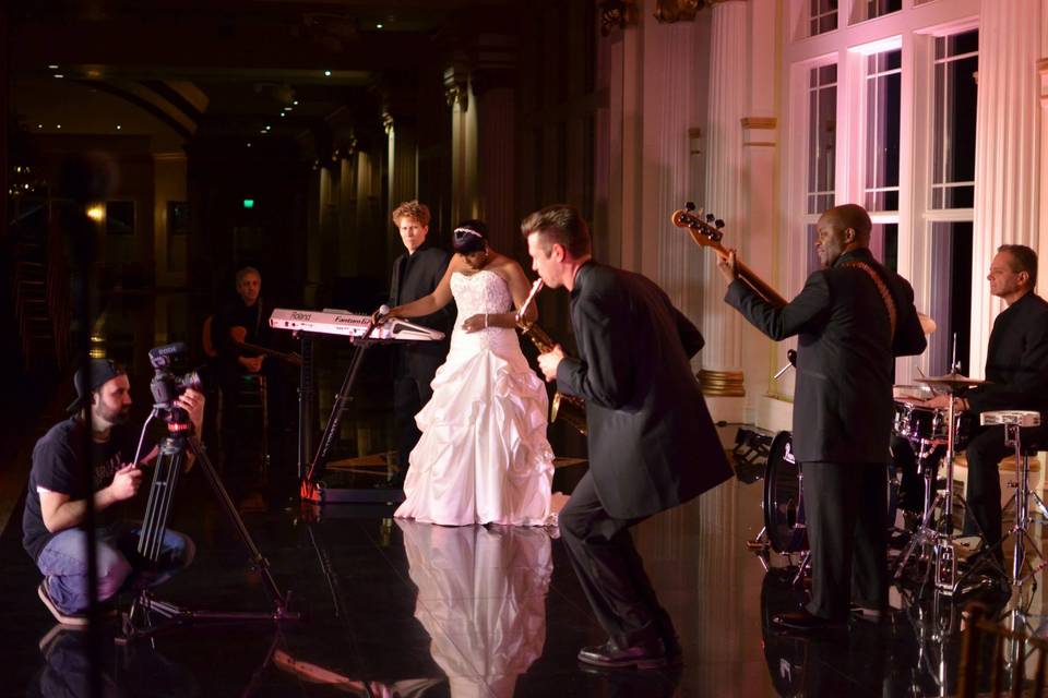 Bride with the members of the band on stage