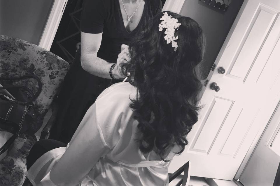 Bride having makeup applied