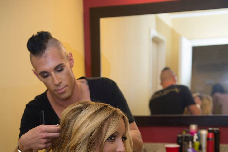 Bride having hair styled