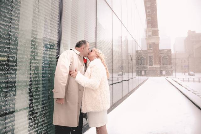 Loving couple with falling snowflakes