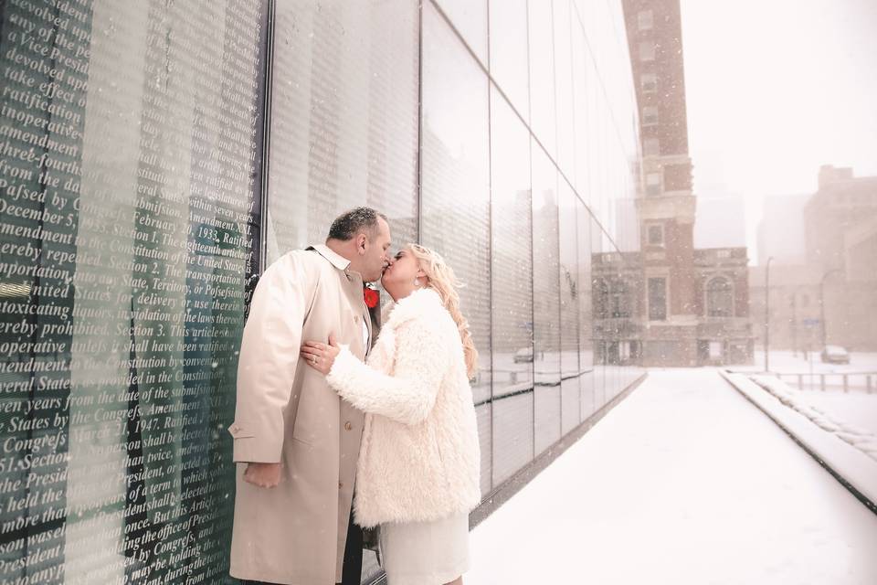 Loving couple with falling snowflakes