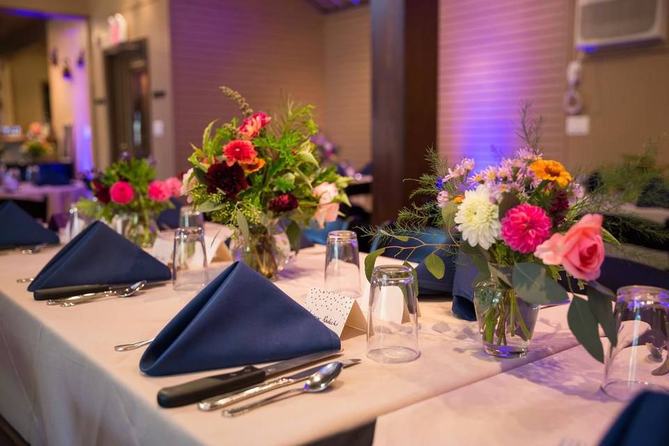 Navy napkins and floral centerpieces