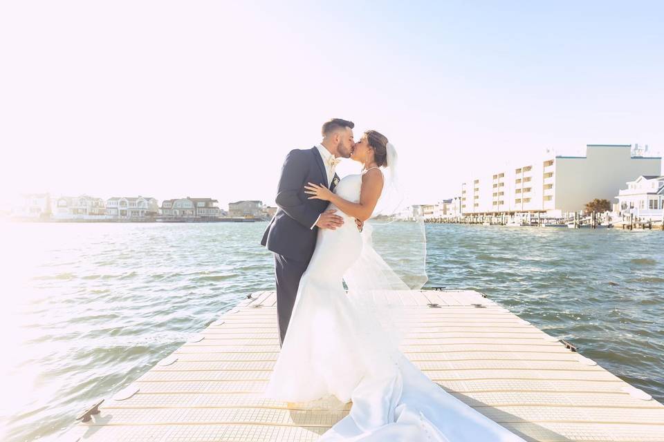 Romantic kiss by the docks