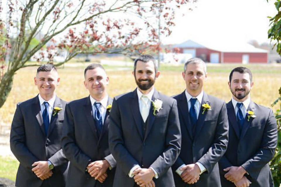 Wedding party standing in suits