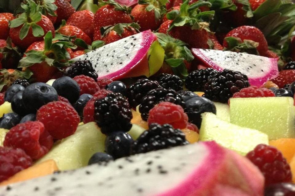 Modern fruit display with Melons, Berries and Dragonfruit