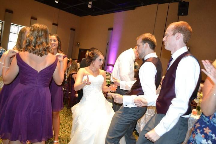 Guests dancing with the bride